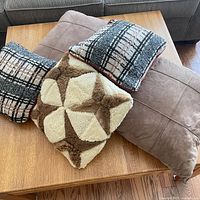 Stack of four pillows showing overall variety and colors