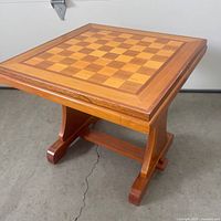 Full view of square chess side table showing top and base