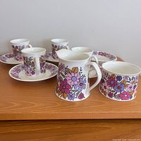 Group view showing cups, saucers and creamer in Portobello pattern