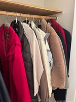 Closet rod with eight jackets in assorted colors and styles