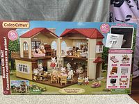 Box of Calico Critters Red Roof Country Home showing set contents and branding.