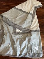 King size duvet cover with grey stripes displayed unfolded showing fabric and color.