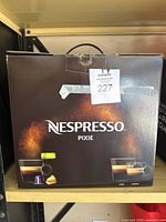 Boxed Nespresso Pixie coffee machine with product label and packaging intact.