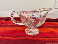 Left side view showing starburst cuts, pedestal foot and overall profile