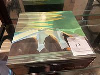 Box containing set of four McIntosh mugs decorated with Lawren S. Harris paintings