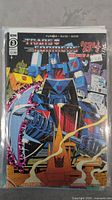 Transformers '84 #3 comic book with colorful cover featuring several Transformers characters