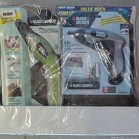 Photo of sealed Black & Decker power scissors and cordless rechargeable screwdriver home tool lot in packaging