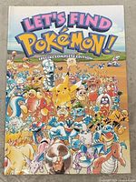 Front cover of 'Let's Find Pokemon! Special Complete Edition' showing many Pokemon characters and colorful title.