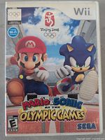 Front cover of Wii game Mario & Sonic at the Olympic Games shows Mario and Sonic characters with Olympic rings and Beijing 2008 marks.