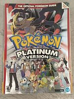 Front cover of the Pokémon Platinum Version Official Strategy Guide showing key characters and Pokémon from the game.