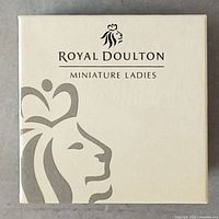 Top of factory box featuring Royal Doulton logo and 'Miniature Ladies' text in beige and gray tones.