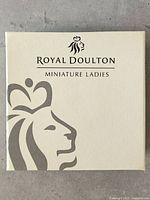 Closed cream colored Royal Doulton Miniature Ladies branded box.