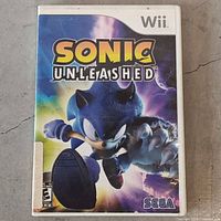 Front cover of Sonic Unleashed Wii game case showing title, Sonic character, ESRB rating, and Sega branding.