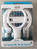Front of Nintendo Wii Sports Kit accessory pack sealed in factory packaging showing all included attachments.