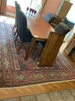 Full view of rug under dining table showing overall pattern and size