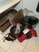 Overview of all items showing the crock pot, basket, fondue pot with forks, and vacuum in one photo.