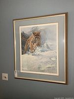 Full view of the framed print showing the mountain lion in snow.