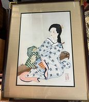 Full framed watercolour painting showing entire composition of woman seated in kimono with accompanying items and beige matte.