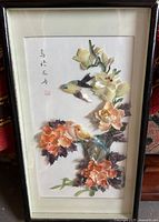 Full view of the framed vintage Chinese shadow box art with shell-crafted birds and flowers.