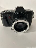Front view of Pentax P3 camera with attached lens