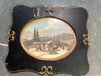 Full view of framed print showing frame shape and damage
