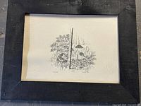 Full view of framed drawing showing black wooden frame and artwork