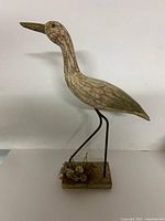 Full view of heron sculpture left profile showing height and base