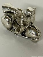 Full view of silver-tone Vespa charm