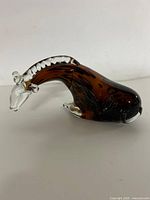 Full view of amber and black speckled art glass giraffe figurine