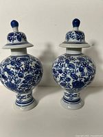 Front view of both ginger jars showing shape and pattern