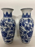 Front view of both vases showing floral blue pattern
