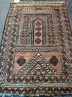 Full view of handmade Persian rug showing overall pattern and colors