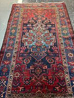 Full view of Persian Touserkan rug showing entire field and borders