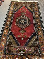 Full view of entire rug showing central medallion and borders