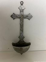 Front view of pewter crucifix holy water font showing overall design and font bowl