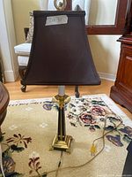Full lamp with shade, cord visible