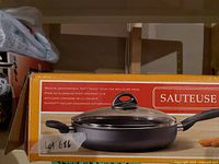 Retail box front showing image and branding of deep sauté pan with lid