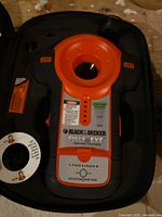 Device inside case showing controls and branding