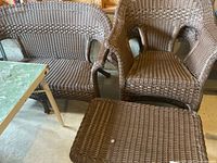 Loveseat and armchair front view with part of table