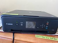 Front view of Canon Pixma TS5020 showing control panel and branding