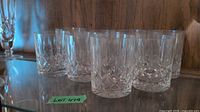 Front view of eight cut crystal tumblers on shelf