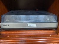 Front view of Harksound turntable with dust cover closed