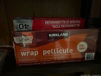 Kirkland Signature plastic food wrap and aluminum foil boxes