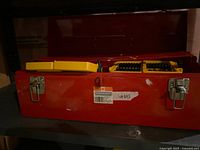 Front view of closed Mastercraft toolbox with DeWalt cases resting on top