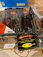 Jobmate socket set, staple gun and Arrow staples grouped on table