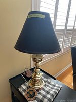 Full view of lamp with shade on side table
