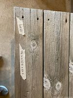 Top view of weathered boards with labels showing dimensions