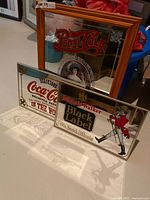 All three advertising mirrors standing together