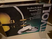 Retail box showing Tivoli 18 inch double oval roaster with image and feature list