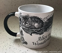 Front side showing Cheshire Cat artwork and part of quote